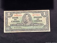 Front of 1937 Bank of Canada one dollar bill with King George VI portrait, signatures, serial numbers and denomination details.