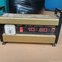 Front view showing Sears branding, 12 V 10/50 A ratings, ammeter