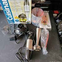 Full set with box, motor, chopper bowl, immersion shaft, whisk, power cord, manual
