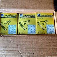 Open case showing three boxed GE Standard Halogen PAR38 bulbs
