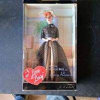 Front view of boxed Barbie doll