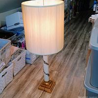 Full view of illuminated Stiffel lamp with shade