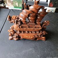 Full view of carved wood dragon boat figurine