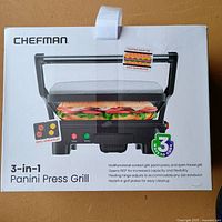Front of sealed box showing Chefman 3-in-1 Panini Press Grill product