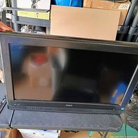 Front view of RCA 26" LCD TV on stand