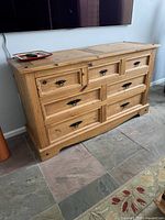 Front view showing all seven drawers and hardware