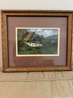 Front view of framed print showing artwork, mat, and carved frame