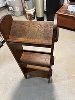 Front angled view showing three shelves and wedge joinery