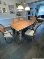Dining table with six chairs around it