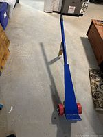 Full view of blue Johnson bar with red wheels