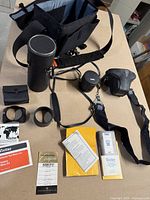 Overall view showing bag, lens cases, camera case, straps, hoods, paperwork