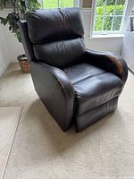 Front angled view of dark brown leather recliner