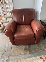 Front view of brown leather club chair