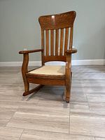Front view of rocking chair showing overall form and cushion