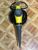 Hot Shot handheld steam cleaner yellow and black with cord, model YQ3888 is visible on base