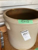 Full view of crock showing exterior and dimensions label