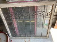 Full view of leaded glass window showing frame and pattern