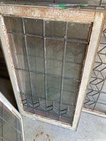 Full view of leaded glass window showing frame and pane layout
