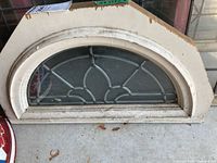 Full view of arched window showing frame and glass