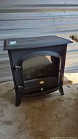 Front view of Dimplex black electric fireplace stove