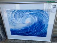 Full view of framed artwork showing wave image, mat, frame