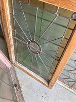 Full view of leaded glass window in wooden frame