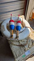Life ring and two buoys overall view