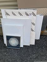 Group shot showing all canvases stacked with framed art