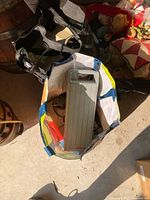 Bag with grey plastic cartridge carrying case visible