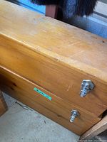 Exterior of wooden storage chest with metal latches