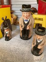Three Royal Doulton Winston Churchill Toby mugs in three sizes