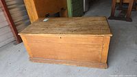 Full view of wooden storage chest front and top