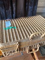 Closed wicker suitcase basket with handles