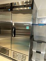 Front exterior view of stainless steel freezer showing door and handle