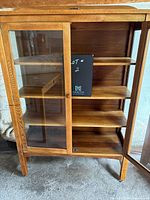 Front view with one door open showing interior shelving