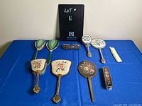 Full overview of all vanity set items including brushes, mirrors, comb, and decorative box