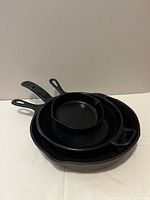 All three skillets nested for scale