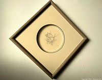 Framed drawing hung on wall showing full frame orientation