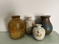 Group shot showing all four vases front and size comparison