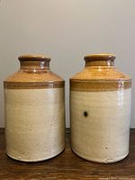 Front view of both two-tone stoneware crocks