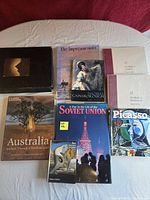 Overview of all nine books laid out on table