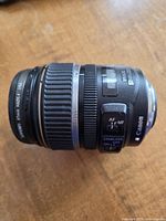 Canon EF-S 17-85 mm lens side view showing AF/MF and stabilizer switches