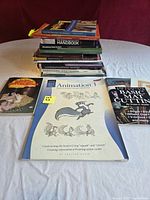 Front view showing animation workbook and woodworking books