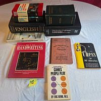 All ten books laid out on table showing covers and spines