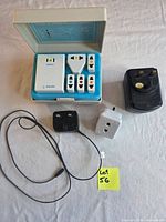 All items laid out: Philips travel kit, two black transformers, grey plug adapter