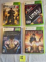 Front view of four Xbox 360 games: Gears of War 3, Xbox Live Arcade Triple Pack, Fable: The Journey, Fable III