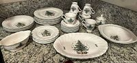 Complete view of all dinnerware pieces including plates, cups, saucers, sugar bowl, gravy boat, serving bowl, and platter.