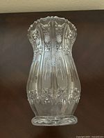 Side view of vintage Bohemian clear lead crystal vase showing the detailed cut crystal pattern and flared scalloped rim.