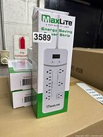 Photo showing one MaxLite power strip box upright, displaying the front with brand, product name, and basic design features.