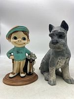 Front photo of Golfer Bob and dog ceramic figurines side by side showing overall appearance and details